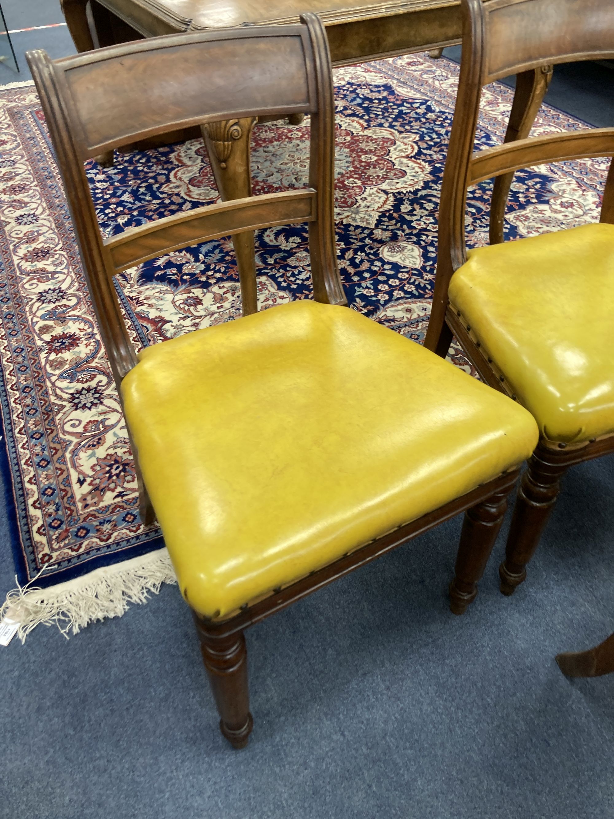 A set of six early Victorian mahogany dining chairs, two with arms